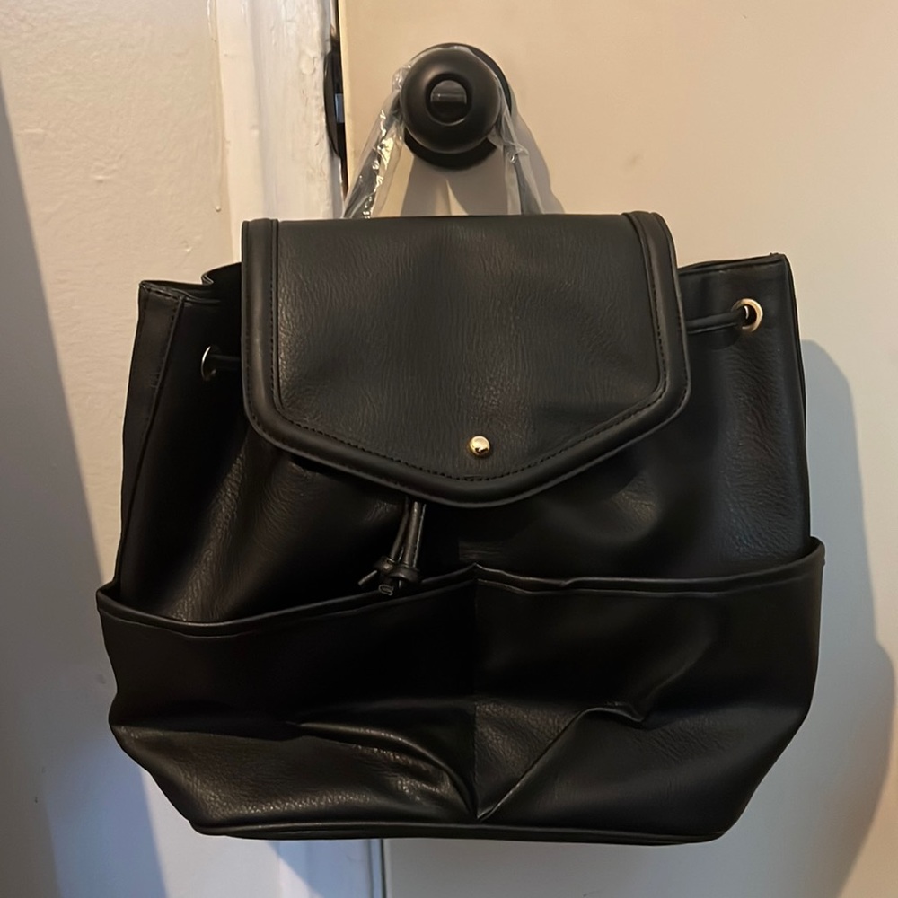 All black multi pocket black “leather” backpack